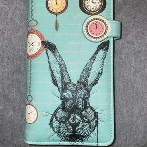 Rabbit and Clock wallet. To me it’s a vintage type of Alice & Wonderland style.